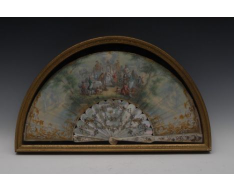 A 19th century French mother-of-pearl and paper fan, painted with an arrangement of courting couples, their attendants, carri
