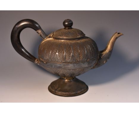 An Indian silver compressed bullet shaped teapot, embossed with bands of lotus, ebonised finial and scroll handle, domed circ