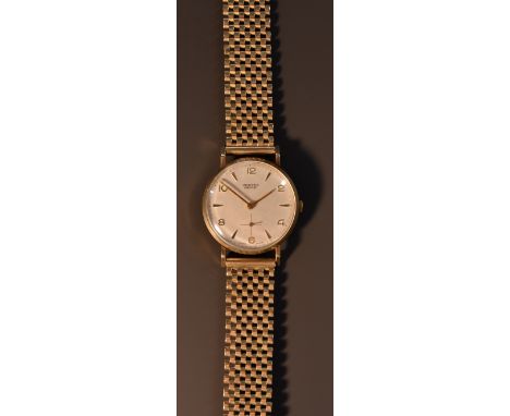 Vertex - a gentleman's 9ct gold Revue wristwatch, textured silver dial, alternating Arabic numerals and arrow batons, minute 