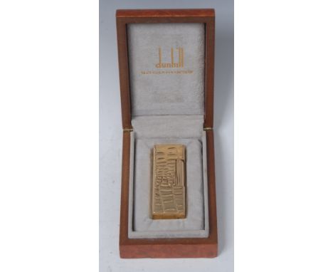 Dunhill - an 18ct gold cigarette lighter, hinged cover, faux crocodile skin texture, model no.1633, 6.5cm long, marked 18kt o