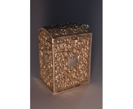 An Edwardian silver rectangular playing card box, embossed overall with dense scrolling foliage, centred by vacant cartouches