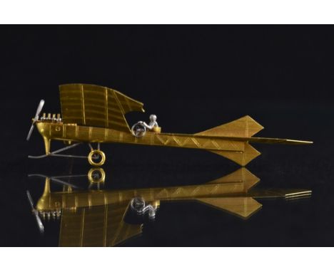 An 18ct gold and white metal brooch of The Antoinette IV or VII monoplane, which attempted to be the first aircraft to cross 