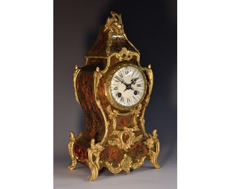 A Louis XV Revival gilt metal mounted boulle cartouche shaped mantel clock, 8cm circular enamel dial inscribed with Roman and