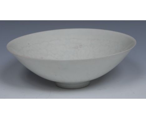 'A Chinese Qingbai bowl, the interior moulded in light relief with lotus scrolls, 20.5 cm