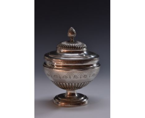 An early 19th century silver half-fluted pedestal tea caddy or sugar box, possibly Colonial, domed cover with acanthus knop f