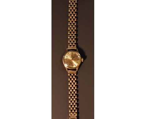 Omega - a lady's 9ct gold bracelet wristwatch, gold sunburst dial, block batons, ridged hands, manual wind 620 cal movement, 