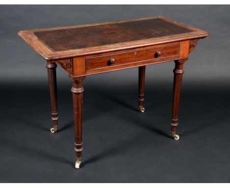 A Victorian mahogany rounded rectangular writing table, moulded oversailing top with inset leather writing surface, above a l