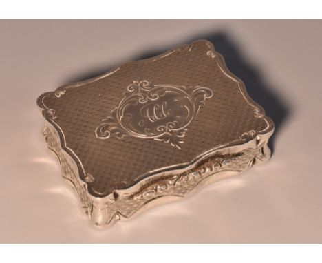 A Victorian silver shaped rectangular vinaigrette, the hinged cover enclosing a gilt interior with pierced grill, engraved wi