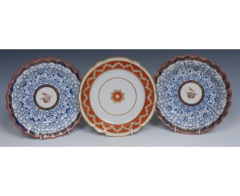 A pair of Flight Worcester Royal Lily pattern Armorial shaped circular plates,  the centre with a bird and coronet, panelled 