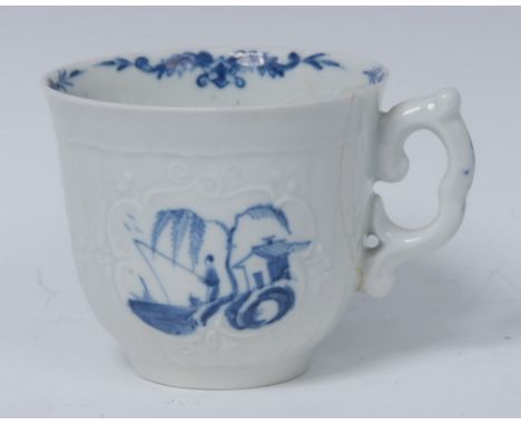 A Worcester The Fisherman and Willow pattern moulded coffee cup,  painted in blue with willow tree, figure and hut within rai