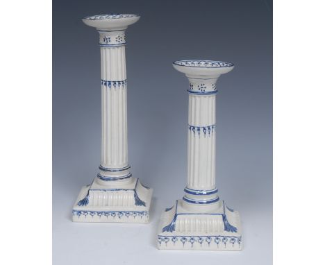 A Wedgwood Pearlware candlestick, dished sconce, fluted column, spreading square fluted  base, leaves to angles, picked out o