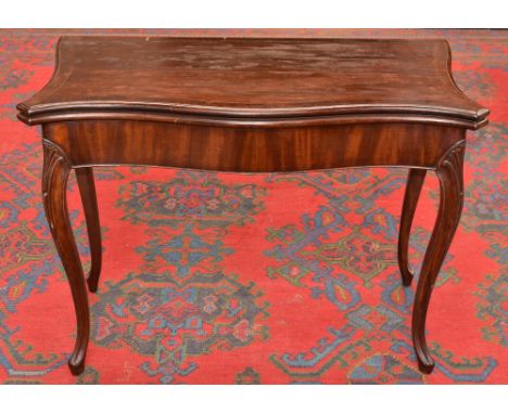 A George III French Heppelwhite serpentine card table, folding top enclosing an inset baize lined playing surface, carved sle