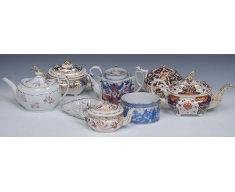 A Derby boat shaped teapot and cover, decorated in tones of blue 5cm high, crown, crossed batons and D mark in red, c.1800;  