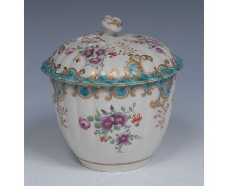 A Worcester fluted sucrier and cover, decorated with stylised flowers and foliage, the border in turquoise and gilt feathered