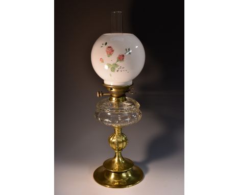 A Victorian glass and brass oil lamp, Hinkes and Co. patent, milk glass shade, facetted clear glass reservoir, bulbous column