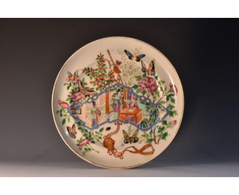 An 18th century Chinese circular famille rose gift dish, decorated with blue scroll cartouche with two figures by a scholar s