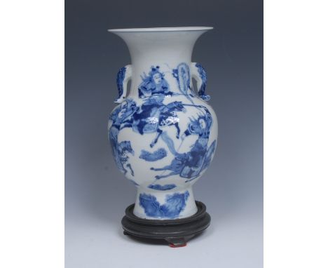 A 19th century Chinese blue and white, decorated in cobalt blue with warriors and banner bearers, scaled scroll handles, 26cm