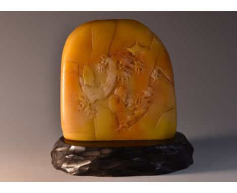 A 19th century Chinese butterscotch soapstone scholar's boulder, carved in relief recto and verso with sages contemplating na
