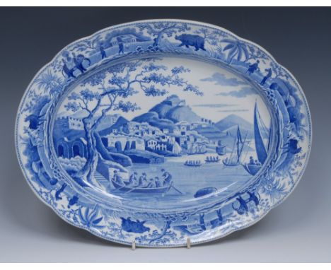 A Spode Caramanian Series oval meat plate, transfer printed in tones of blue,  the border with elephants, rhinoceros, cattle,