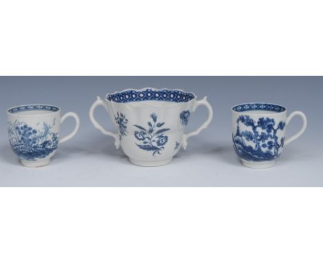A Worcester Rock Strata Island pattern coffee cup, painted in underglaze blue with hut, trees and rockwork, the interior with