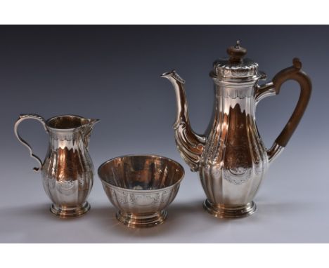 A George V silver three piece fluted baluster coffee service, of George II design, comprising coffee pot, milk jug and sugar 