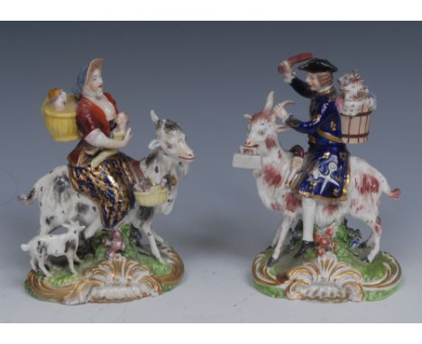 A pair of  Derby figures, The Welch Tailor and Wife, he seated astride a  goat, he wearing a tricorn hat with a pannier on hi