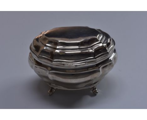 A late Victorian silver bombe shaped tea caddy, hinged cover, scroll feet, 13cm wide, Charles Stuart Harris, London 1901, 7.5