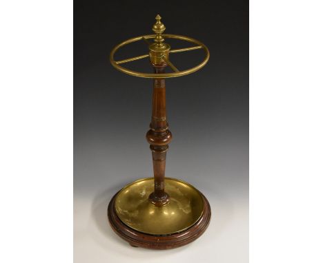 A Victorian mahogany and gilt-brass walking-stick stand, circular four-section frame surmounted by an urnular finial, turned 