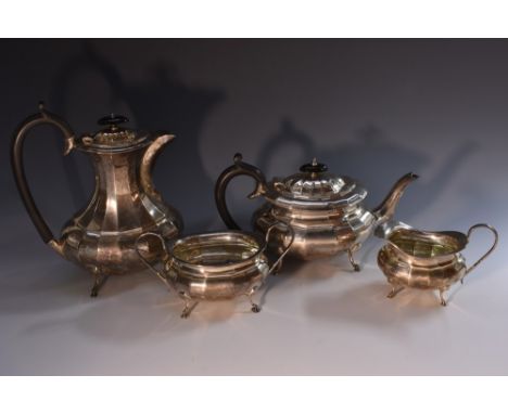 A composed George V and later silver four piece fluted tea service, comprising teapot, water pot, milk jug and sugar basin, s