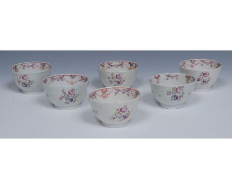 A set of six  New Hall tea bowls, decorated in the famille rose palette with stylised flowers and foliage, c.1800