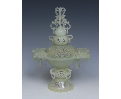 A Chinese jade censer, pierced and carved in the Archaic taste with scrolls and rings, 27cm high
