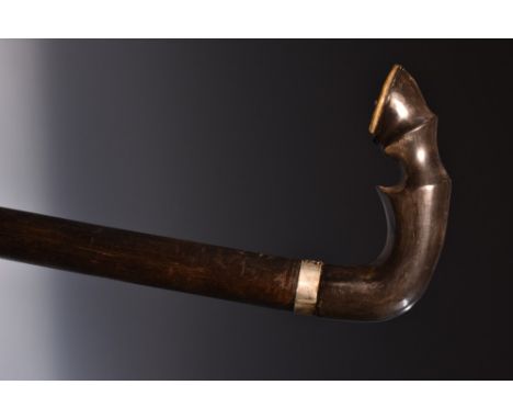 A late 19th century novelty horn and hardwood walking stick, the crook handle carved and terminating in a horse's fetlock, si