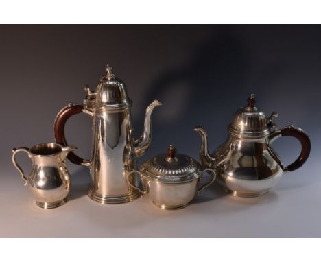 A George I style silver four piece tea and coffee service, comprising pear shaped teapot, spreading cylindrical coffee pot, b