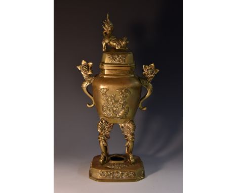 A late 19th century Chinese gilt patinated bronze censer, the vasular reservoir cast with blossoming peonies and songbirds in