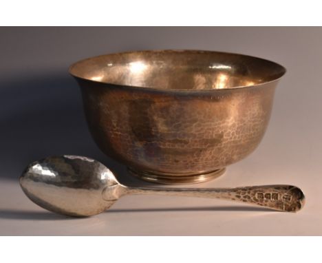 An Arts and Crafts bowl and spoon, planished overall, 12.5cm diam, Charlie Jacques & Frederick Bartholomew, London 1902