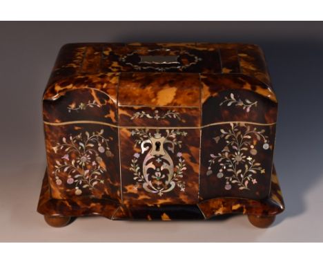 An early Victorian tortoiseshell and abalone marquetry commode shaped tea caddy, hinged cover enclosing a pair of lidded comp