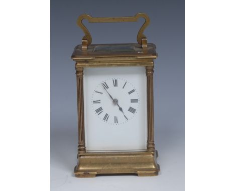 An early 20th century French lacquered brass carriage clock, 6cm white enamel rectangular dial painted with Roman numerals an