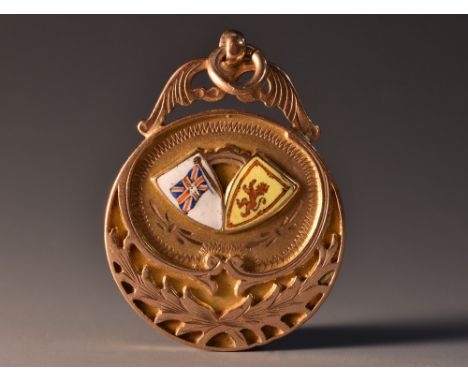 A 9ct gold enamelled football medal, awarded to  J Brown Secy, of the Dunblane Rovers for winning the S J L Vic Cup, dated 19