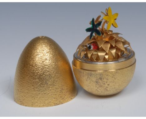 Stuart Devlin (Bn.1931) - an Elizabeth II parcel-gilt silver Surprise Egg, the interior with ladybird and flowers, textured f