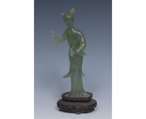 A Chinese green jade dancer, wearing flowing robes, 19cm high, hardwood stand