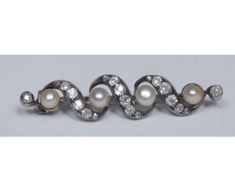 A diamond and pearl brooch, wavy crest platform inset with four cultured pearls and twenty round and rose cut diamonds, total