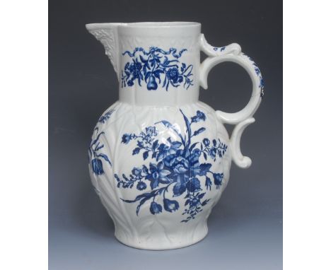 A large Worcester Mansfield pattern cabbage leaf moulded mask jug, painted in underglaze blue, double-scroll handle, 29.5cm h