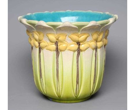 A BURMANTOFTS FAIENCE JARDINIERE, early 20th century, of cylindrical form with lobed rim, moulded in relief with stylised yel