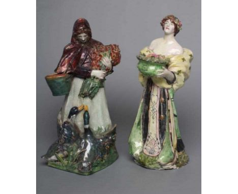 SIDNEY KEATS COPE - a pair of slip cast pottery figures in the style of Charles Vyse, modelled as young women, one with flowe