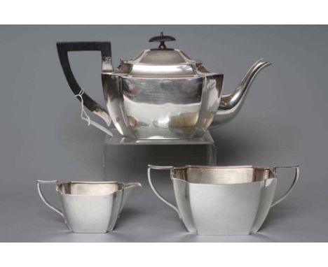 AN EDWARDIAN SILVER THREE PIECE TEA SERVICE, maker R &amp; W Sorley, Sheffield 1897, of oblong form with curved canted angles