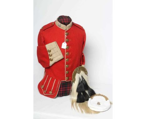 A HIGHLAND LIGHT INFANTRY RED TUNIC, together with a Royal Highland regimetal sporran, and a "Peter Fergusson" style sporran 