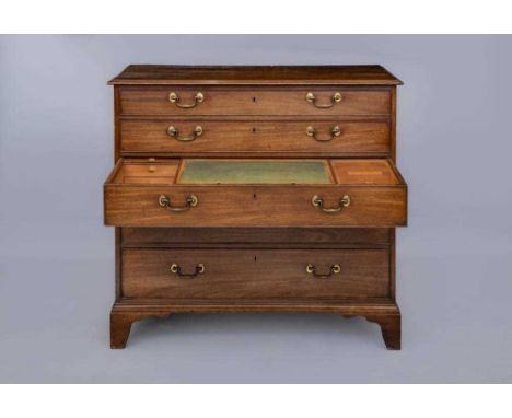 A GEORGIAN MAHOGANY SECRETAIRE CHEST, late 18th century, the moulded edged top over five graduated drawers with brass bale ha