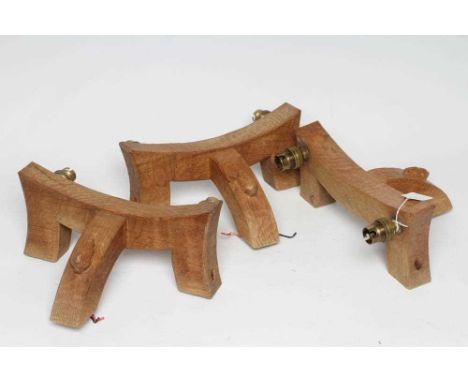 PETER HEAP OF WETWANG, a set of three adzed oak wall lights, of square section concave form issuing two light fittings, the c