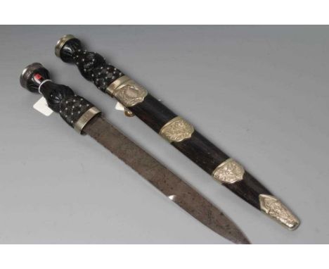 TWO SCOTTISH DIRKS, comprising a Scots Guards military example by Robert Mole, c.1905, the 12" blade with broad arrow mark an