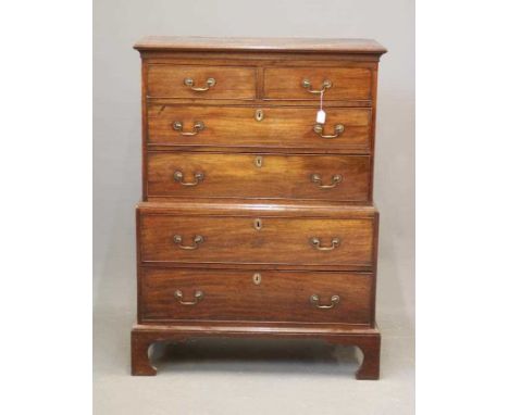 A MAHOGANY CHEST ON CHEST, 18th century and later, the cavetto moulded cornice over two short and two long drawers with brass